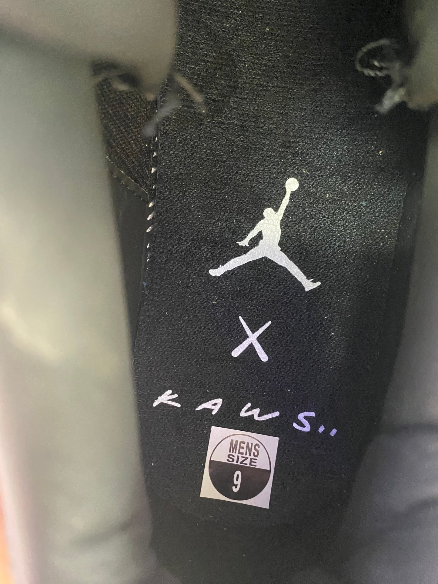 Air Jordan 4 Retro x KAWS 2017 Black/Glow