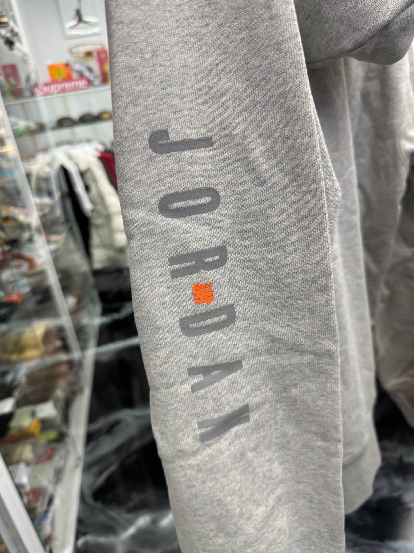 Jordan × Undefeated Weights Hoodie
Heather Grey