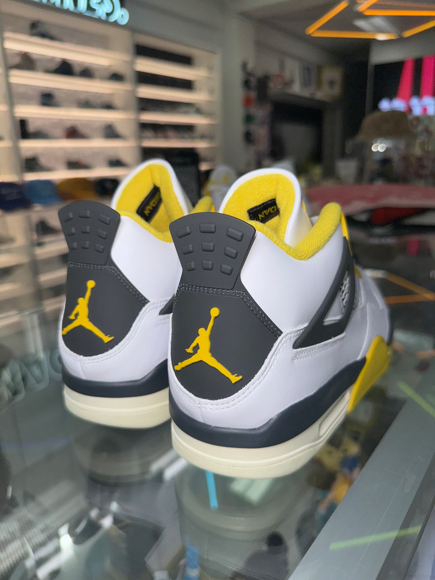 Jordan 4 Retro
Vivid Sulfur (Women's)